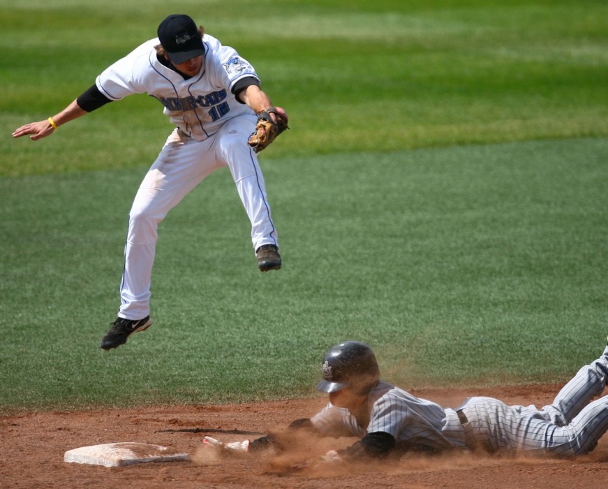 Edmonton Cracker Cats' Chris Becker tries to tag out Calgary Vipers' Manabu Kuramochi at the bottom of the fourth inning during the Northern League series finale at Telus Field Sunday. Kuramochi made it safe to second. 2007.