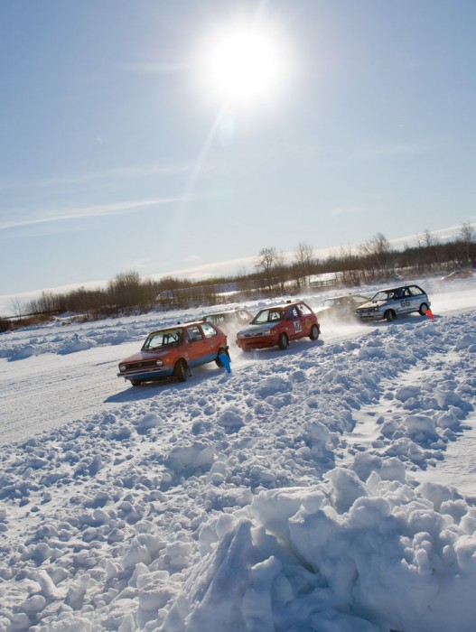 Cars speed around the track during the first rubber race at the Northern Alberta Sports Car Club Ice Racing event at Telford Lake near Leduc on January 31, 2009.
