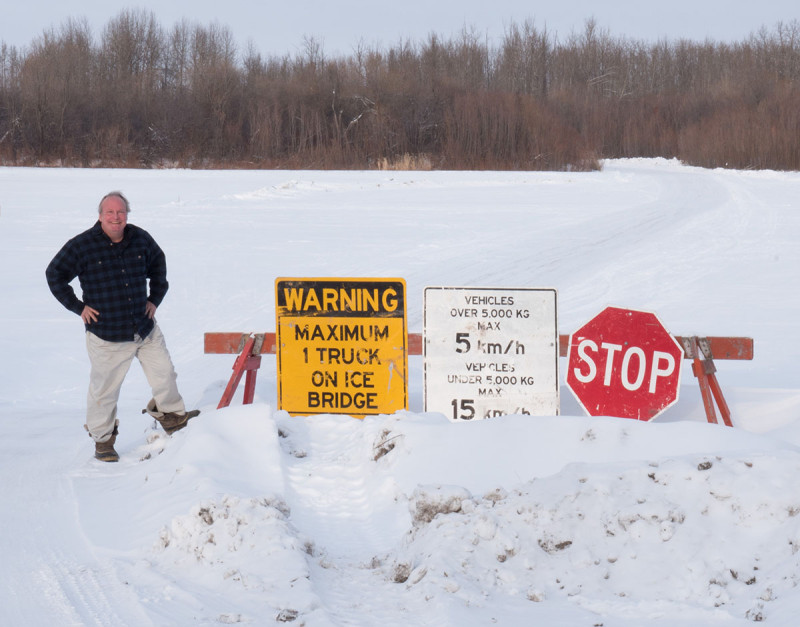 Journal reporter Marty Klinkenberg poses for a photo at one of the river crossings along the winter ice road from Fort McMurray to Fort Chipewyan in Northern Alberta on on February 4, 2015.