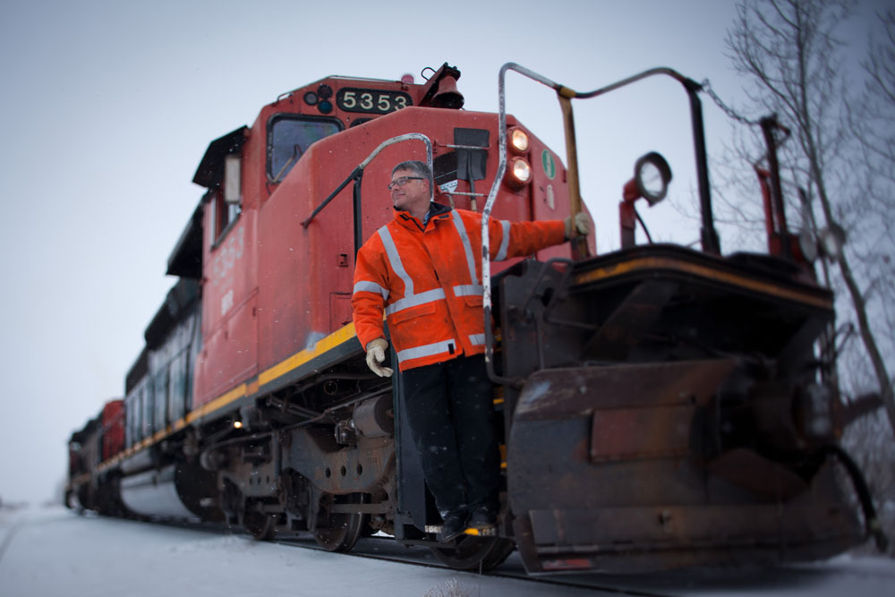 Will Munsey, volunteer Engineer for the Battle River Railway, poses for a photo in Forestburg, Alta. on December 1, 2012.  The BRR is a community-owned railway line between Camrose and Alliance, Alta. The new generation co-op purchased the 80-km short-line from CN in 2008 after they announced they were going to sell off the rails for scrap. By keeping the line active, local area farmers are able to save money and time transporting their grain. The co-op also turns a profit which it returns to it's shareholders and plans to offer tourism and oil transport in the future.