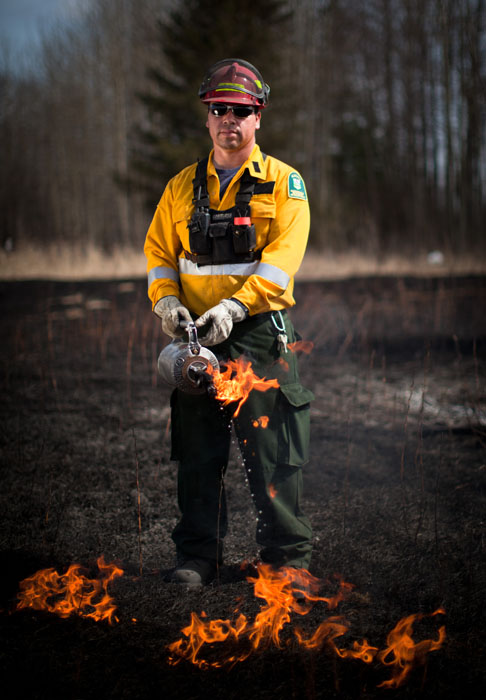 Sheldon Houle, Helitack Leader with Alberta Sustainable Resources Development shows a controlled burn in Slave Lake, Alta. on May 2, 2012.   Dry grass is burned away every spring in hazardous areas to reduce the risk of wildfires.