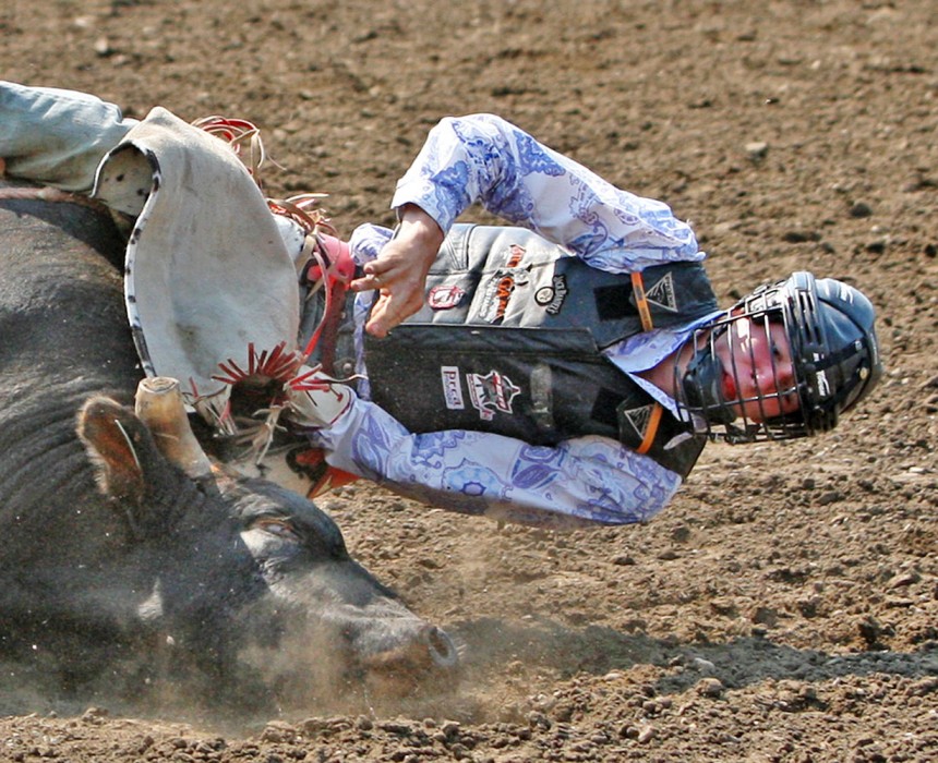 Joe Guze gets a little too close to the ground for comfort during the Bulls for Breakfast event at the Big Valley Jamboree in Camrose, Alta. on July 29, 2010.