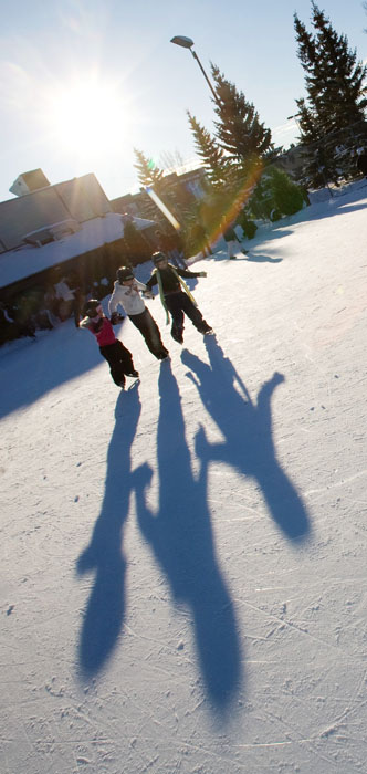 >A trio of seven-year-olds, Seneca Boisvert, left, Kohi Bundred and Bella Rusk, skate in perfect synchronicity with their lengthening shadows.